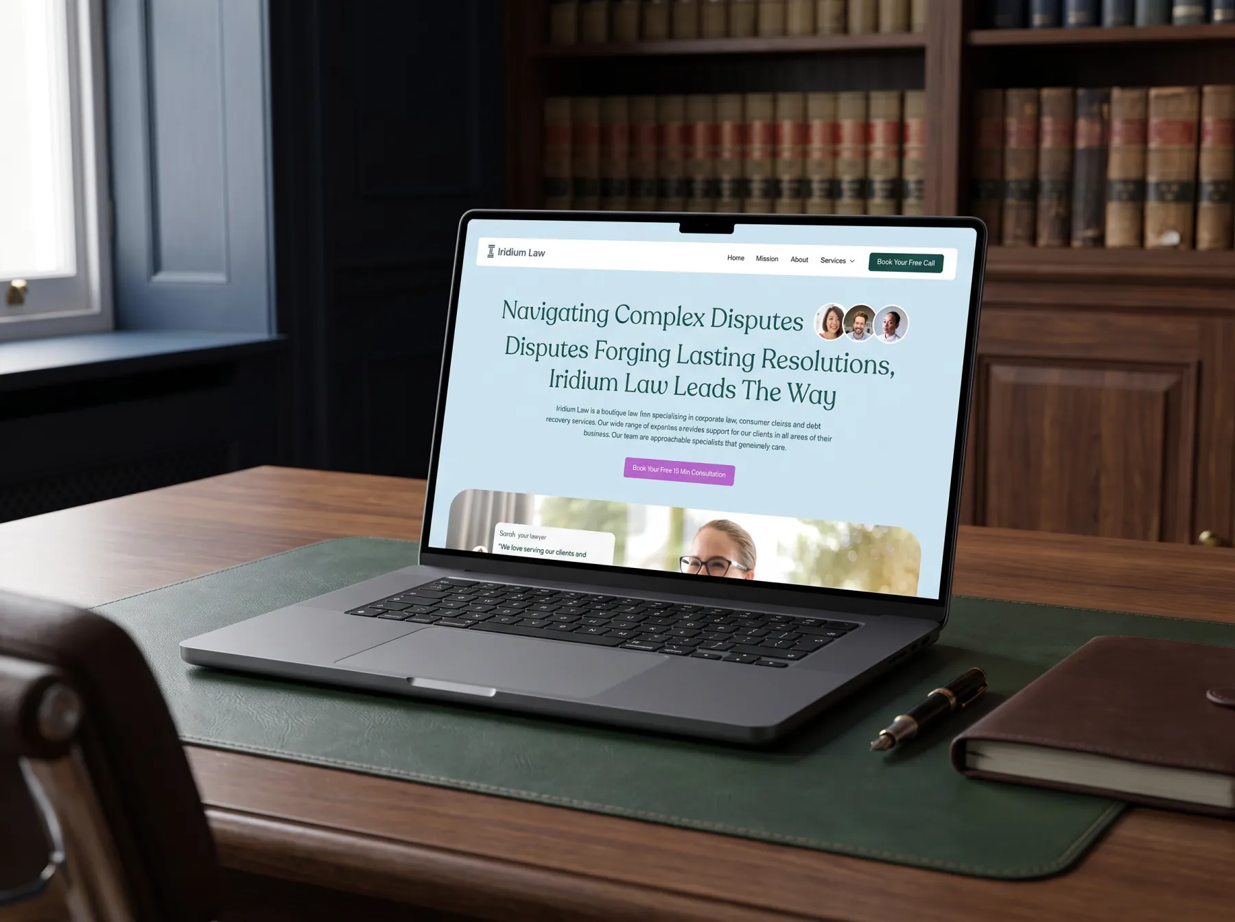 Iridium Law website design on a MacBook Pro on a walnut desk in a London law office