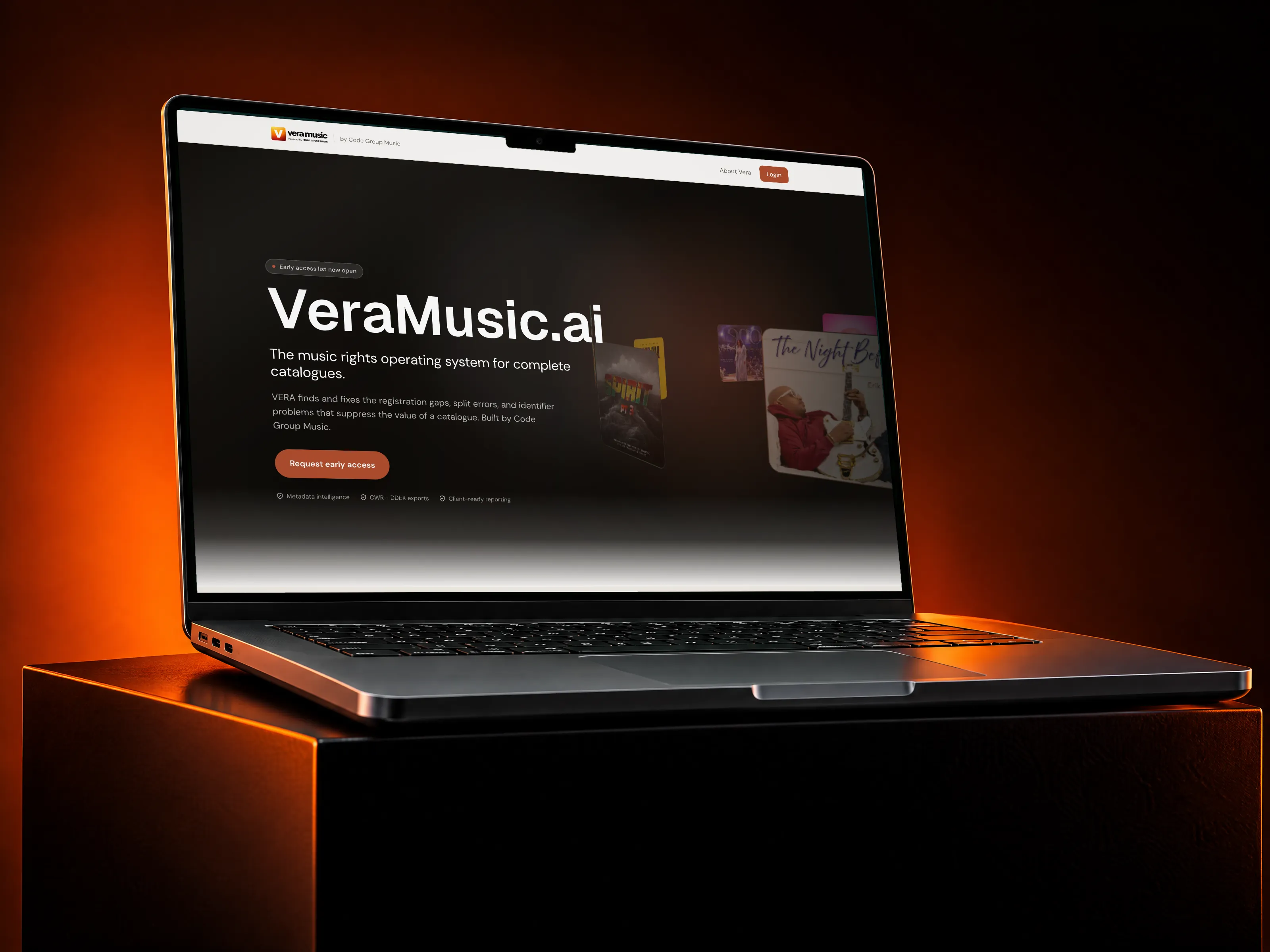 VERA music rights platform on a MacBook Pro on a black block against a dark orange backdrop